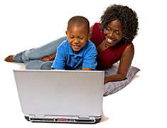 child and mother in front of a computer